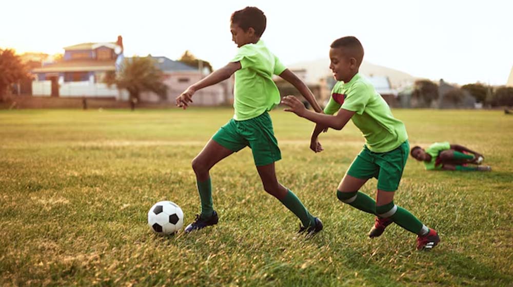 football playing childrend